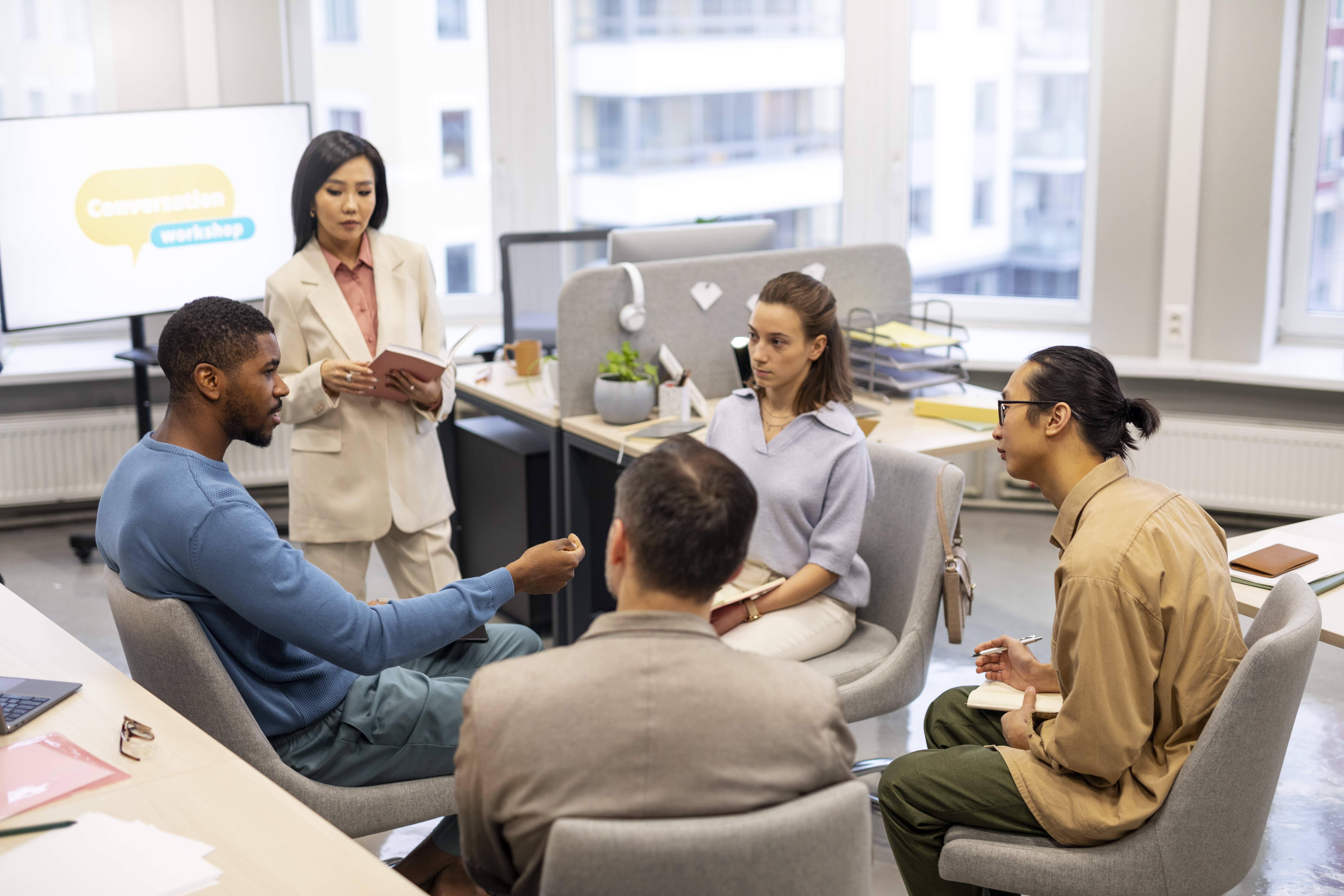 Students learning and communicating in an English language class